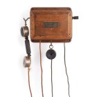 Телефонный аппарат в деревянном корпусе с микротелефонной трубкой и дополнительным наушником
