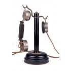 Телефонный аппарат-стойка в металлическом корпусе с микротелефонной трубкой и дополнительным наушником